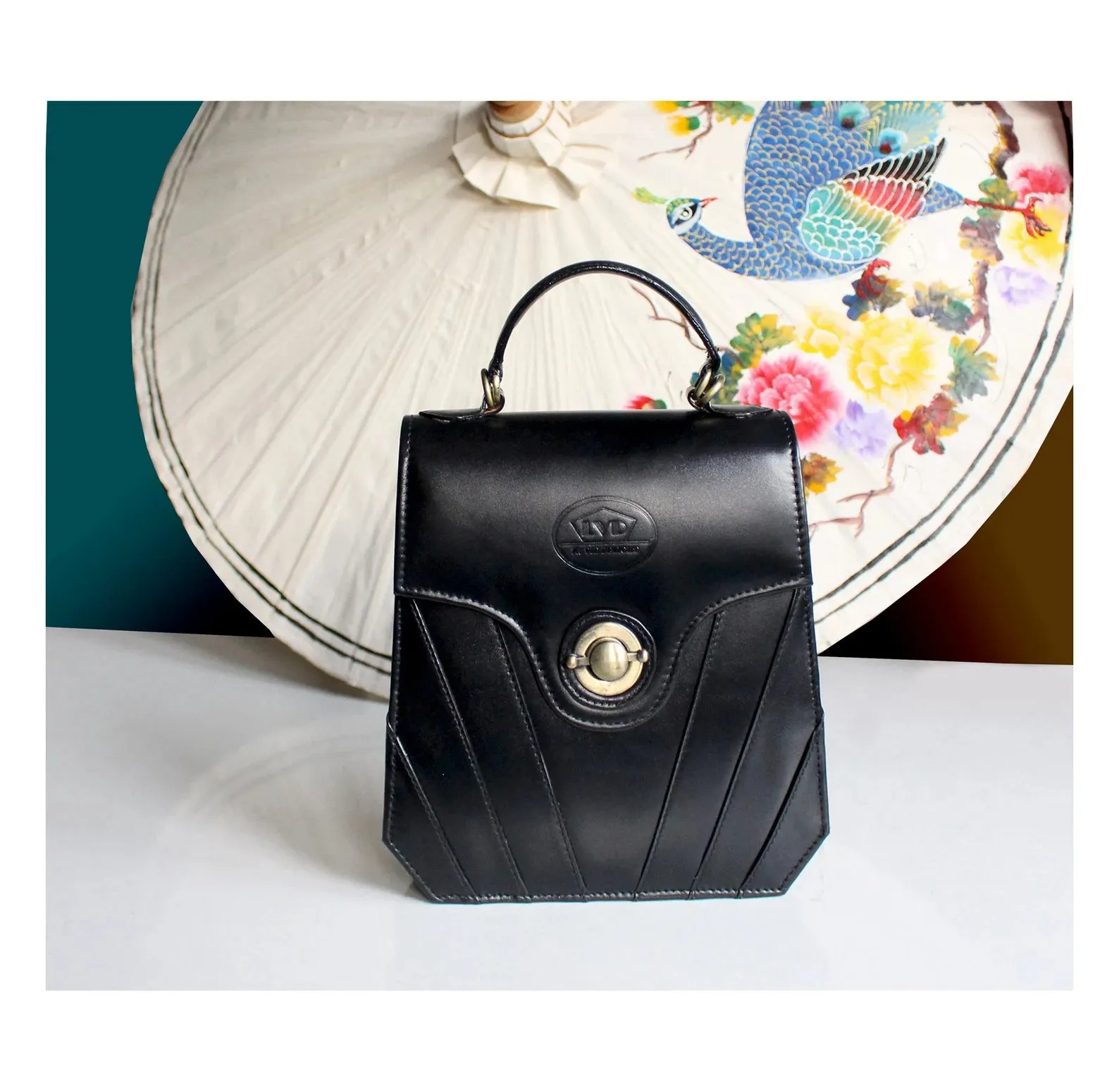 Finely-crafted black leather art deco handbag/purse