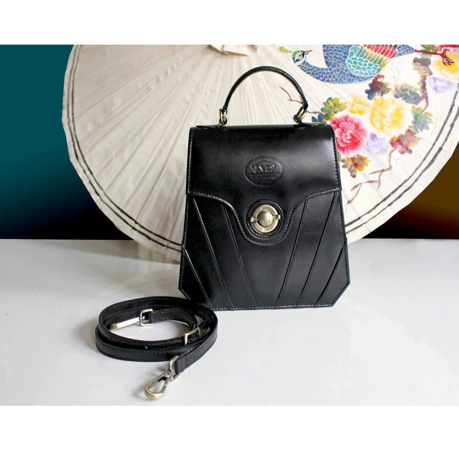 Finely-crafted black leather art deco handbag/purse