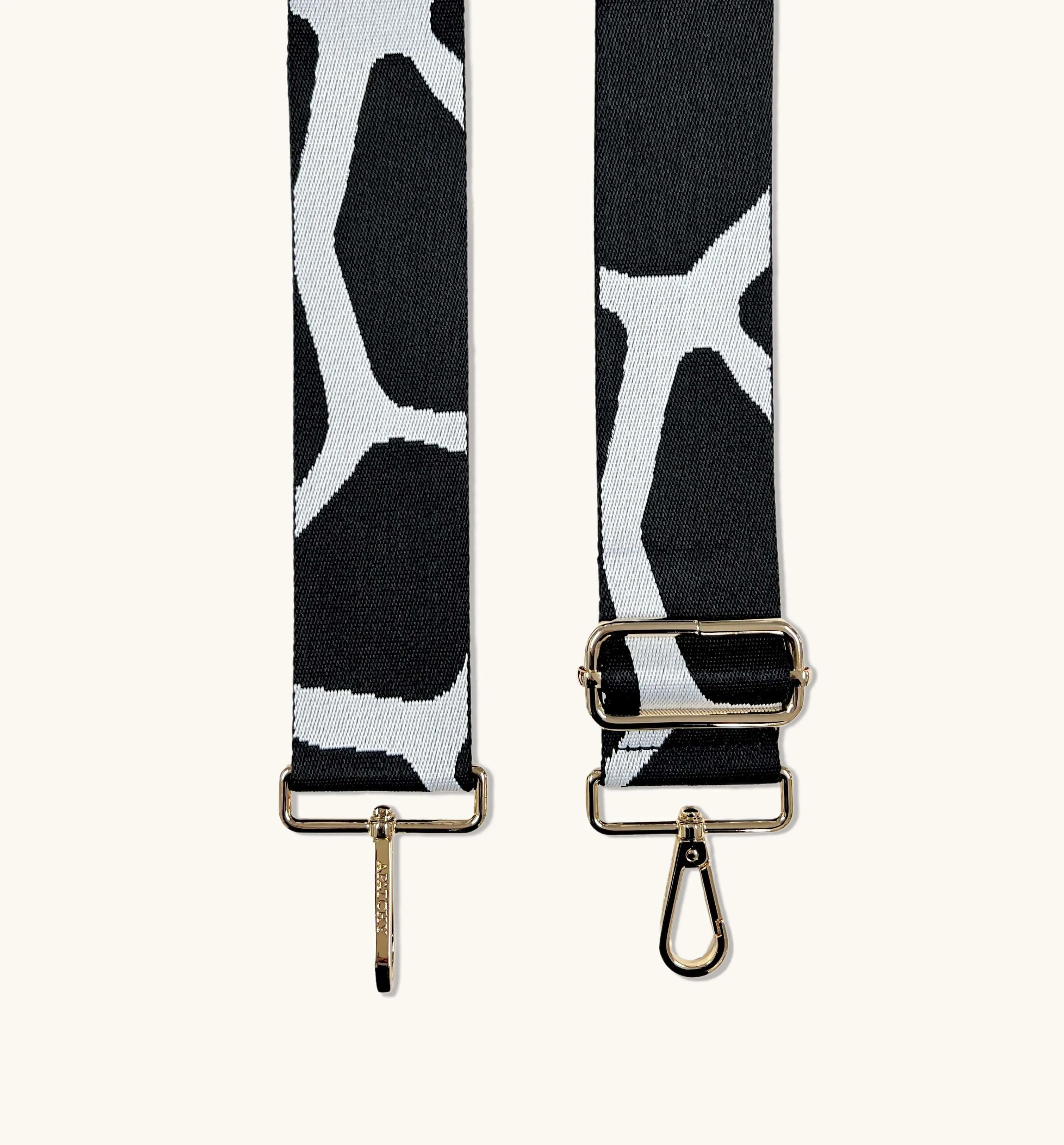 The Tassel Black Leather Crossbody Bag With Black & White Giraffe Strap