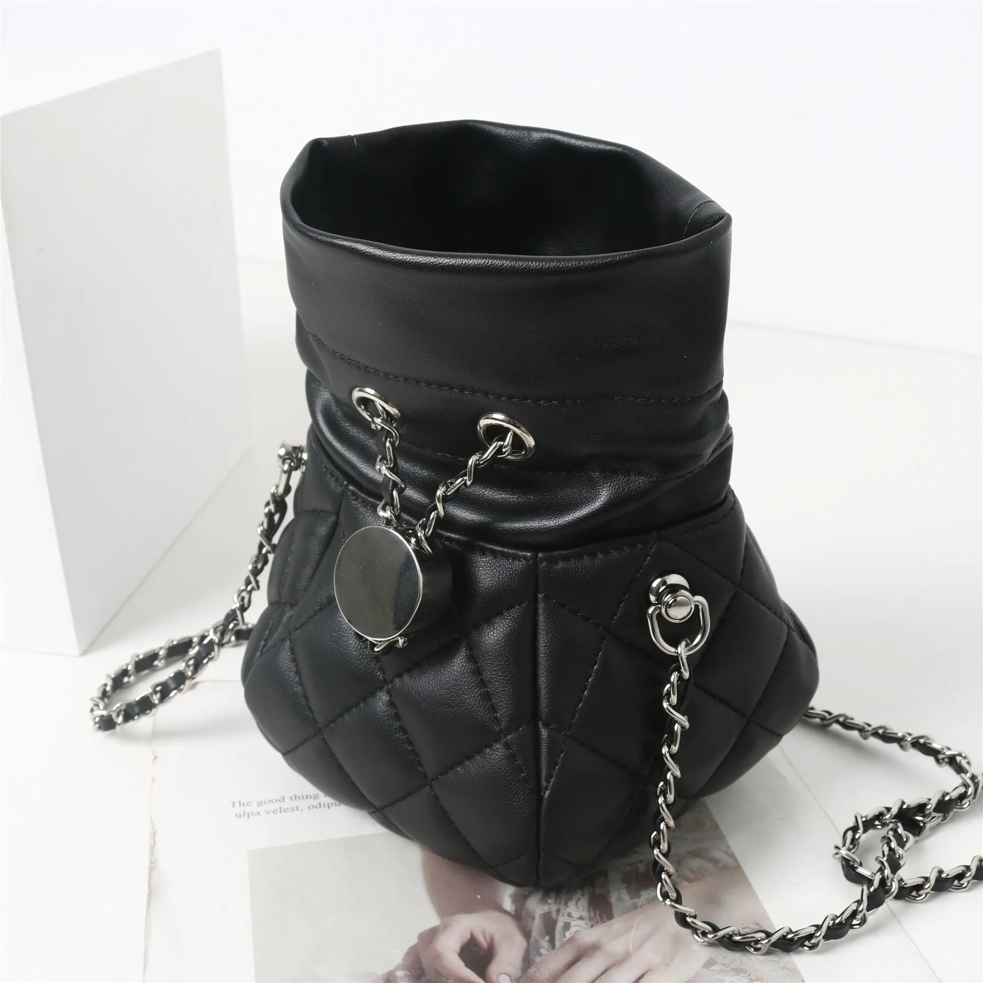 Womens Quilted Leather Mini Drawstring Bucket Bag